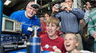 Mike and Ryan Lily, from Glen Ellyn, watch droplets of liquid being levitated using sound waves.