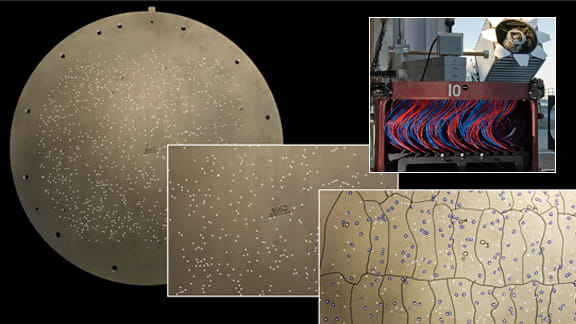 BOSS is capturing accurate spectra for millions of astronomical objects by using 2,000 plug plates that are placed at the Sloan Foundation Telescope's focal plane. Each of the 1,000 holes drilled in a single plug plate captures the light from a specific galaxy, quasar, or other target, and conveys its light to a sensitive spectrograph through an optical fiber. The plates are marked to indicate which holes belong to which bundles of the thousand optical fibers that carry the object's light.