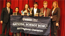 A group of students and teachers holding a banner that reads "National Science Bowl 2013 Regional Champion".
