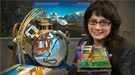 Design Engineer Justine Haupt is pictured in front of the cryostat she designed for testing LSST's electro-optic sensor modules.