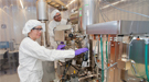 CFN researchers Gwen Wright and Aaron Stein at the electron beam lithography writer in the CFN cleanroom. 