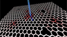 A simulation shows the path for the collision of a krypton ion (blue) with a defected graphene sheet and subsequent formation of a carbon vacancy (red).