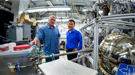 Lumeras founder Andrew Merriam, left, and SLAC/Stanford Professor Zhi-Xun Shen with a tabletop laser the company developed and installed in a laboratory run by SIMES.