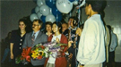 Candice Kamachi (in red coat) and her teammates were greeted as they arrived home in California after winning the 1996 National Science Bowl® in Washington, D.C.