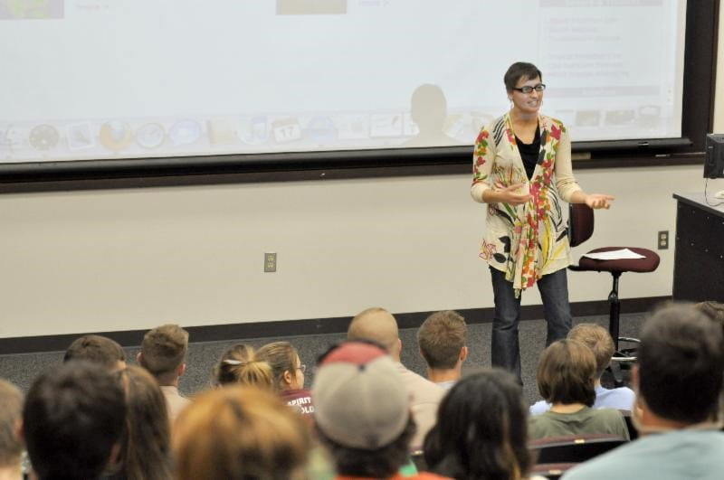 Courtney Schumacher lectures in a Texas A&M University classroom. Photo is courtesy of Schumacher.