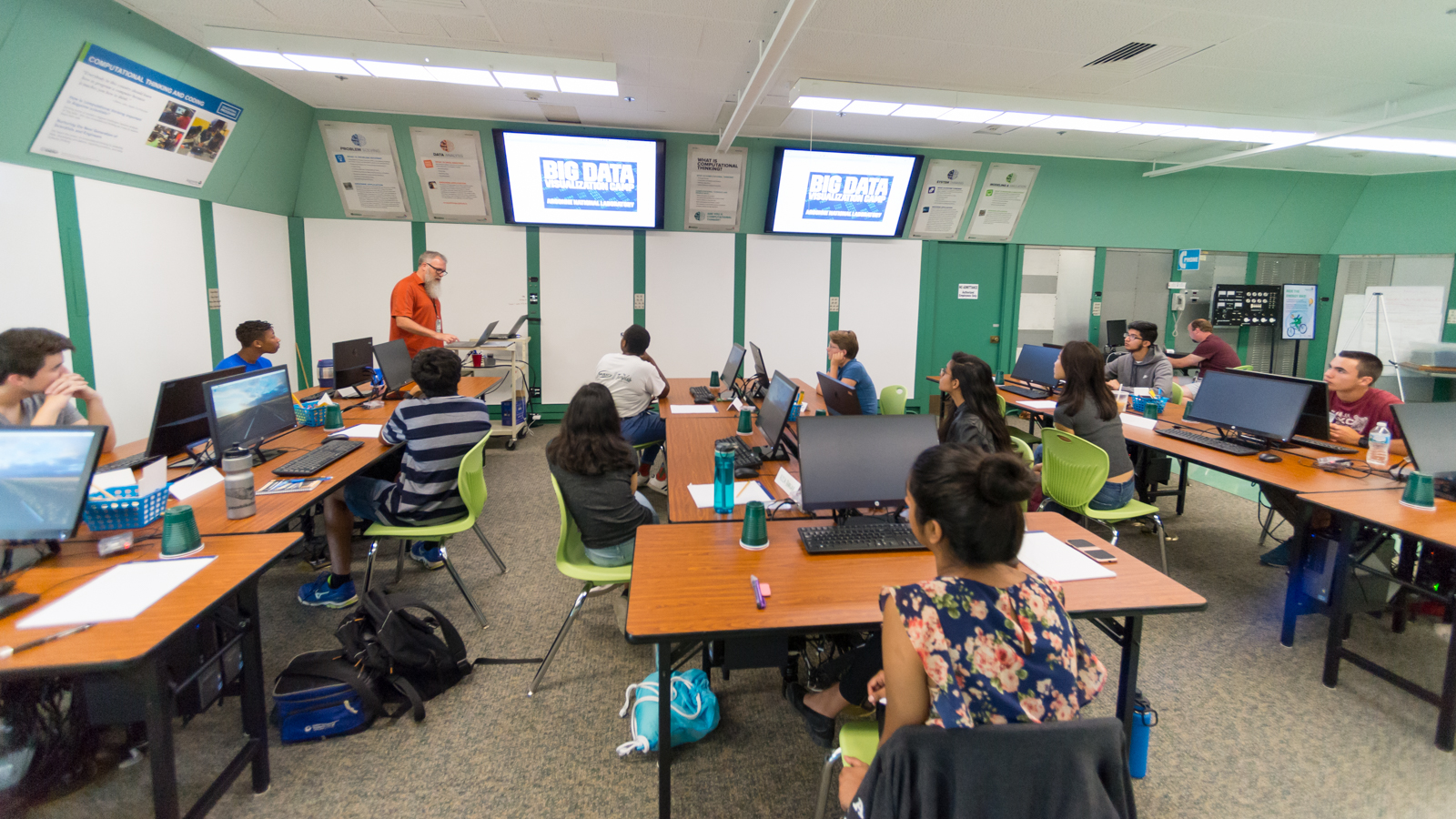 Michael Papka (left) help lead Argonne’s first Big Data and Visualization Camp over the summer. He taught these high schoolers the importance of extracting useful information from an increasingly vast sea of numerical data. (Image by Argonne National Laboratory.)