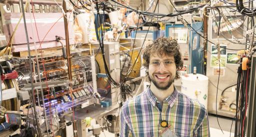 Graduate student Eugene Evans in front of PPPL's field-reversed configuration device