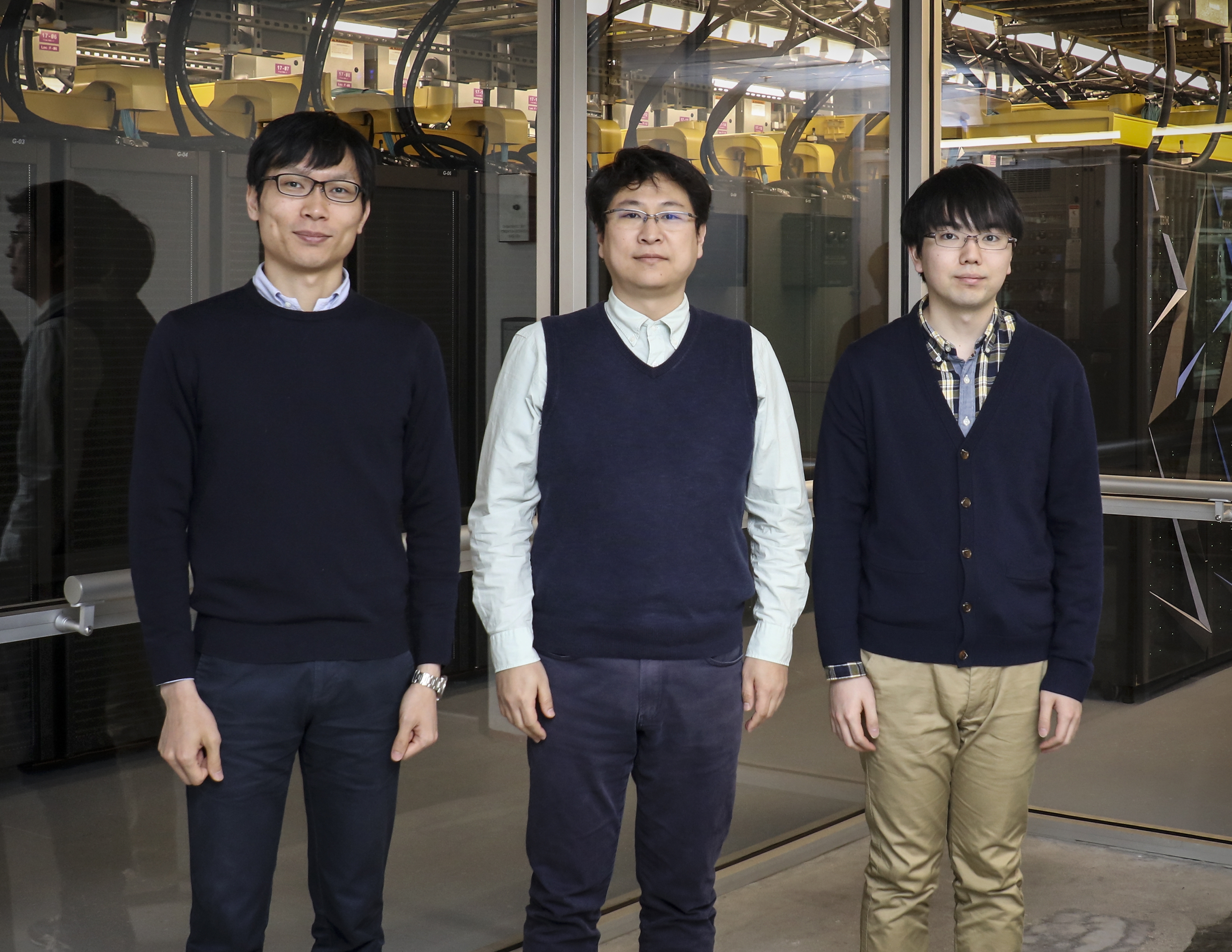 Kohei Fujita (left), Tsuyoshi Ichimura (middle), and Takuma Yamaguchi (right) from the University of Tokyo in Japan simulated a highly complex earthquake wave on Summit, accelerated using AI and transprecision computing. The team achieved a fourfold speedup over its state-of-the-art SC14 Gordon Bell finalist code and have again earned a finalist nomination. Image Credit: Jason Richards, ORNL