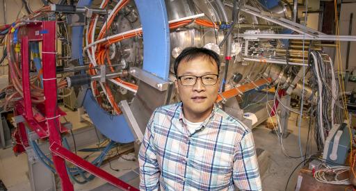 PPPL physicist Jongsoo Yoo stands next to the Magnetic Reconnection Experiment (MRX)