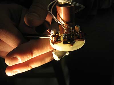 A hand works with an instrument