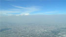 A heavy layer of air pollution, a mix of aerosol particles and vapors, obscures the view over Mexico City.