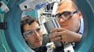 Two scientists working on Argonne's Advanced Photon Source