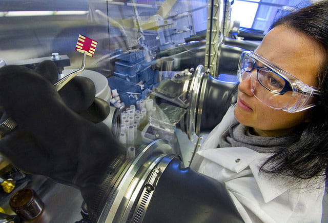 Scientist Claudia Piliego uses lab equipment to handle a solar cell
