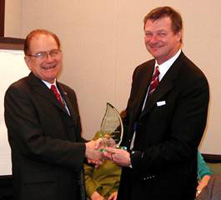 Dr. Raymond L. Orbach, Director of the DOE Office of Science, presents the 2004 Office of Science Best in Class Award