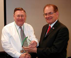 Dr. Raymond L. Orbach, Director of the DOE Office of Science, presents the 2004 Office of Science Best in Class Award