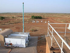 Photo: ARM Mobile Facility collecting cloud and atmospheric  property measurements from a location near the airport in Niamey, Niger,  West Africa