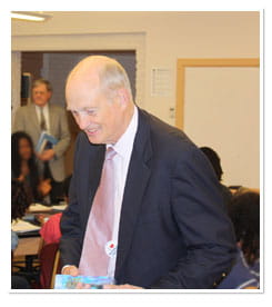 Dr. Brinkman talking with students in a classroom