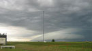 Stormy sky with Atmospheric Radiation Measurement (ARMClimate Research Facility's (ACRF) instrumentation in the foreground