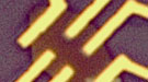 Microscopic view showing three-dimensional “gated” topological insulator device fabricated from (Bi0.50Sb0.50)2Te3 nanoplates.