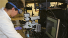 Scientist in the lab surrounded by lab equipment