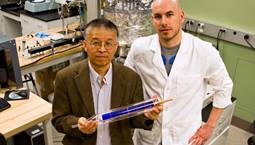 Daniel Kraemer, lead author of the Nature Materials article, and Gang Chen, holding a prototype solar thermoelectric generator tube.