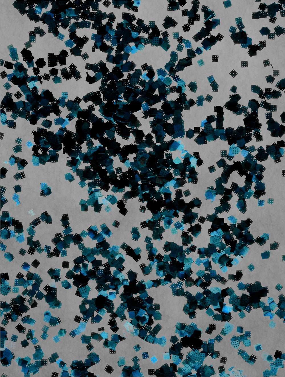 Large collection of microscale GaAs solar cells, released from a multilayer stack of material grown on a wafer