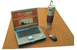 A laptop connected to a cylander 