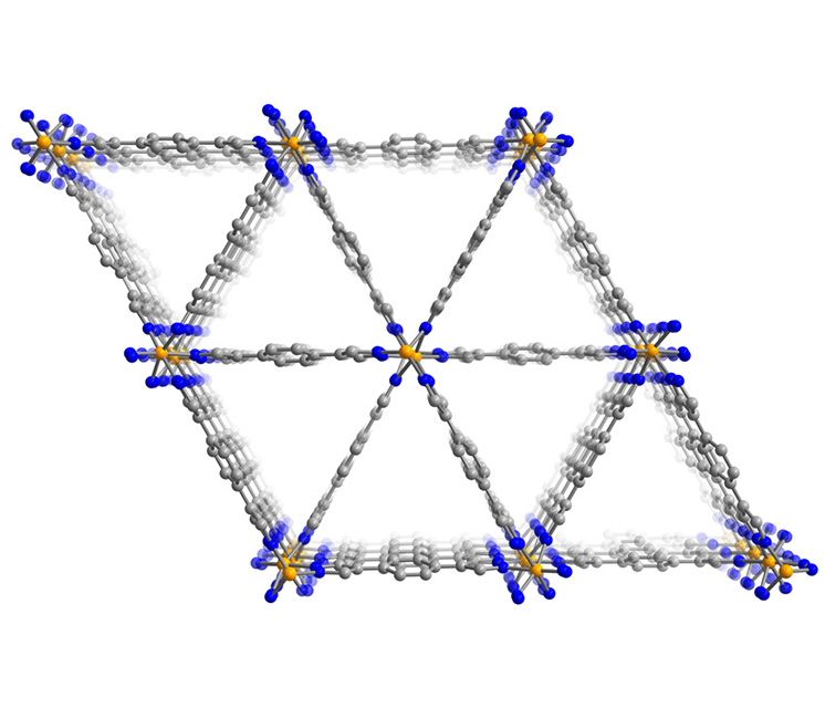The structure of the iron MOF showing iron (orange), nitrogen (blue), and carbon (gray) atoms, as viewed along the triangular channels.