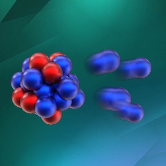 Image of the emission of 4 neutrons (blue spheres) from the exotic nucleus oxygen-28, which consists of 8 protons (red spheres) and 20 neutrons. 