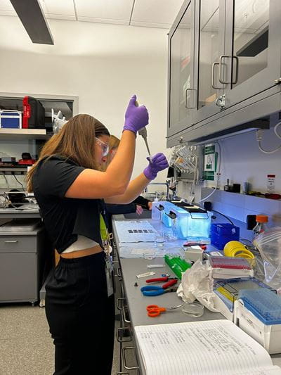 Astrid Reyes-Torres begins her experiment with the plastic-degrading enzyme PETase in Building 743 at the National Synchrotron Light Source II at Brookhaven National Laboratory.