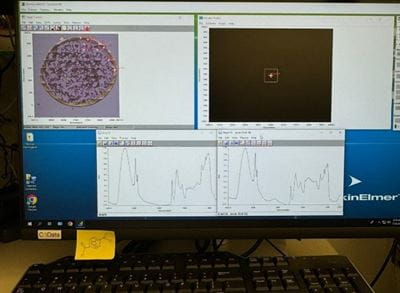 A view of Astrid Reyes-Torres doing the Infrared spectroscopy of the cells, the technique to monitor the algae growth and PETase products. Experiments were located in Building 743 at the National Synchrotron Light Source II at Brookhaven National Laboratory.