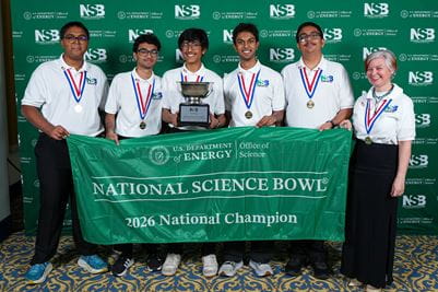 Anish Agarwal, Roshan Annamalai, Theenash Sengupta, Advaith Mopuri, Rutvik Arora, and coach Dorota Sawicka of Mission San Jose High School in Fremont, California pose with the first place trophy at the 2026 National Science Bowl® on Monday, May 4, 2026, in Washington, D.C. Photo by Jack Dempsey for the National Science Bowl®, U.S. Department of Energy Office of Science.