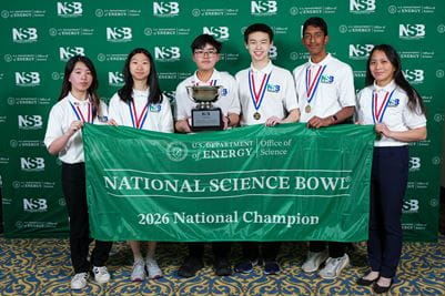 Helene Yang, Andrea Xu, Vince Srirattana, Houwen Wei, Idhant Jaiswal, and coach Wendy Moy of William Diamond Middle School in Lexington, Massachusetts pose with he first place trophy at the 2026 National Science Bowl® on Monday, May 4, 2026, in Washington, D.C. Photo by Jack Dempsey for the National Science Bowl®, U.S. Department of Energy Office of Science.